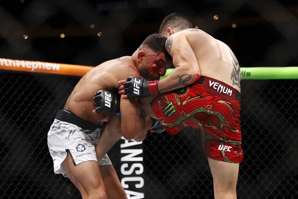 Nov 2, 2024; Edmonton, Alberta, Canada;  Brandon Moreno (red gloves) fights Amir Albazi (blue gloves) in a flyweight bout during UFC Fight Night at Rogers Place. Mandatory Credit: Perry Nelson-Imagn Images