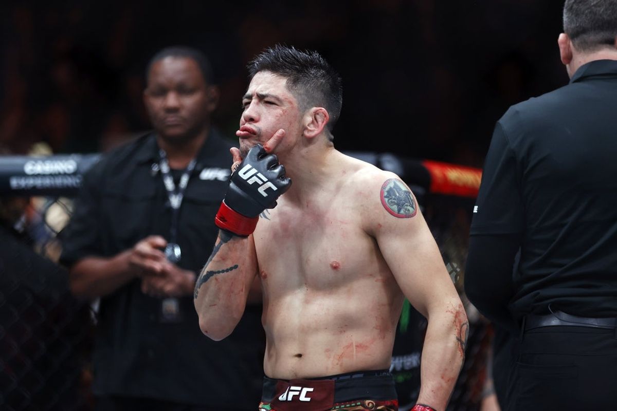 Nov 2, 2024; Edmonton, Alberta, Canada;  Brandon Moreno (red gloves) celebrates after defeating Amir Albazi (not pictured) in a flyweight bout during UFC Fight Night at Rogers Place. Mandatory Credit: Perry Nelson-Imagn Images
