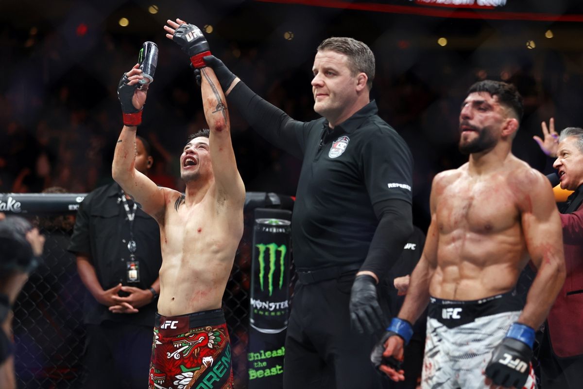 Nov 2, 2024; Edmonton, Alberta, Canada;  Brandon Moreno (red gloves) celebrates after defeating Amir Albazi (blue gloves) in a flyweight bout during UFC Fight Night at Rogers Place. Mandatory Credit: Perry Nelson-Imagn Images