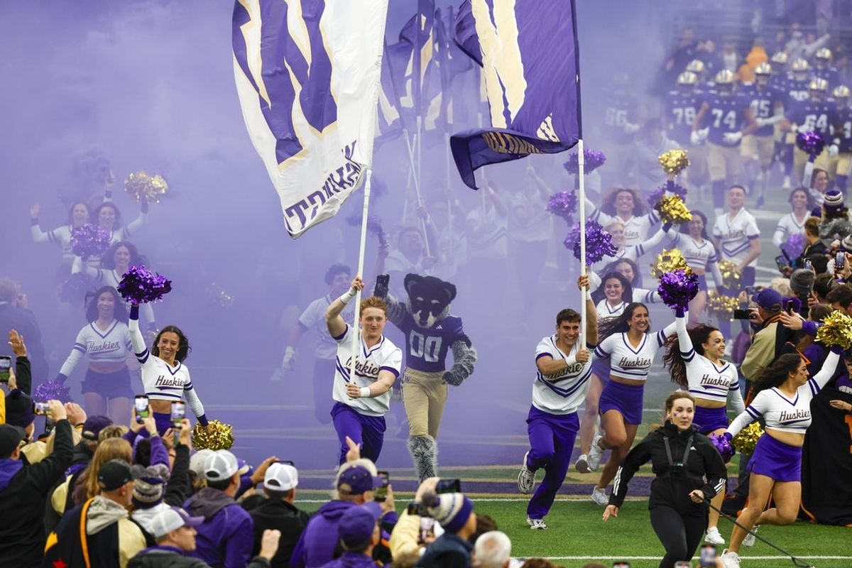 Nov 2, 2024; Seattle, Washington, USA; Washington Huskies cheerleaders lead the team out of the locker room during before a game against the USC Trojans at Alaska Airlines Field at Husky Stadium. Mandatory Credit: Joe Nicholson-Imagn Images