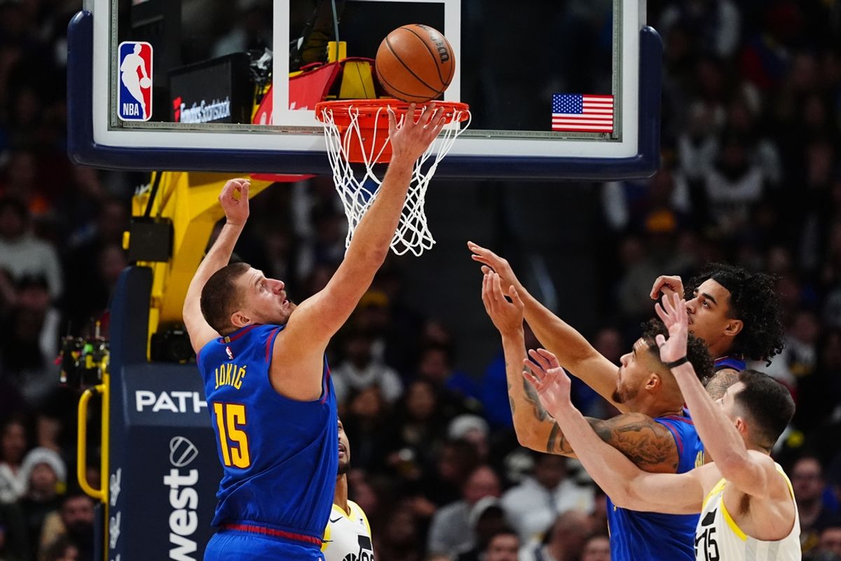 Nov 2, 2024; Denver, Colorado, USA; Denver Nuggets center Nikola Jokic (15) and forward Michael Porter Jr. (1) and guard Julian Strawther (3) and Utah Jazz forward Drew Eubanks (15) reach for the ball in the second half at Ball Arena. Mandatory Credit: Ron Chenoy-Imagn Images