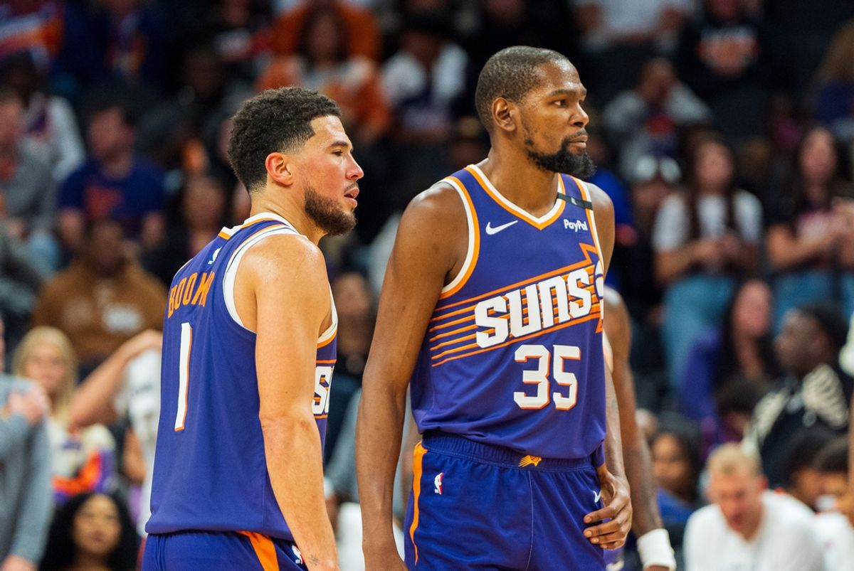 Nov 2, 2024; Phoenix, Arizona, USA;  Phoenix Suns guard Devin Booker (1) and forward Kevin Durant (35) react after a time out late in the second half during a game against the Portland Trail Blazers at Footprint Center. Mandatory Credit: Allan Henry-Imagn Images