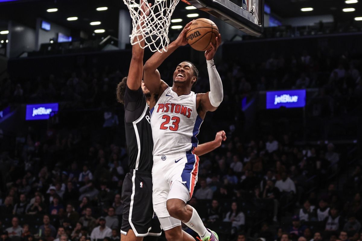 Nov 3, 2024; Brooklyn, New York, USA;  Detroit Pistons guard Jaden Ivey (23) drives past Brooklyn Nets forward Cameron Johnson (2) in the first quarter at Barclays Center. Mandatory Credit: Wendell Cruz-Imagn Images