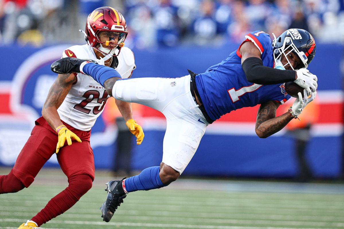 Nov 3, 2024; East Rutherford, New Jersey, USA; New York Giants wide receiver Malik Nabers (1) makes a catch in front of Washington Commanders cornerback Benjamin St-Juste (25) during the second half at MetLife Stadium. Mandatory Credit: Vincent Carchietta-Imagn Images