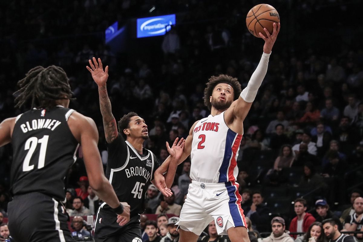 Nov 3, 2024; Brooklyn, New York, USA;  Detroit Pistons guard Cade Cunningham (2) catches a pass in front of Brooklyn Nets guard Keon Johnson (45) in the second quarter at Barclays Center. Mandatory Credit: Wendell Cruz-Imagn Images