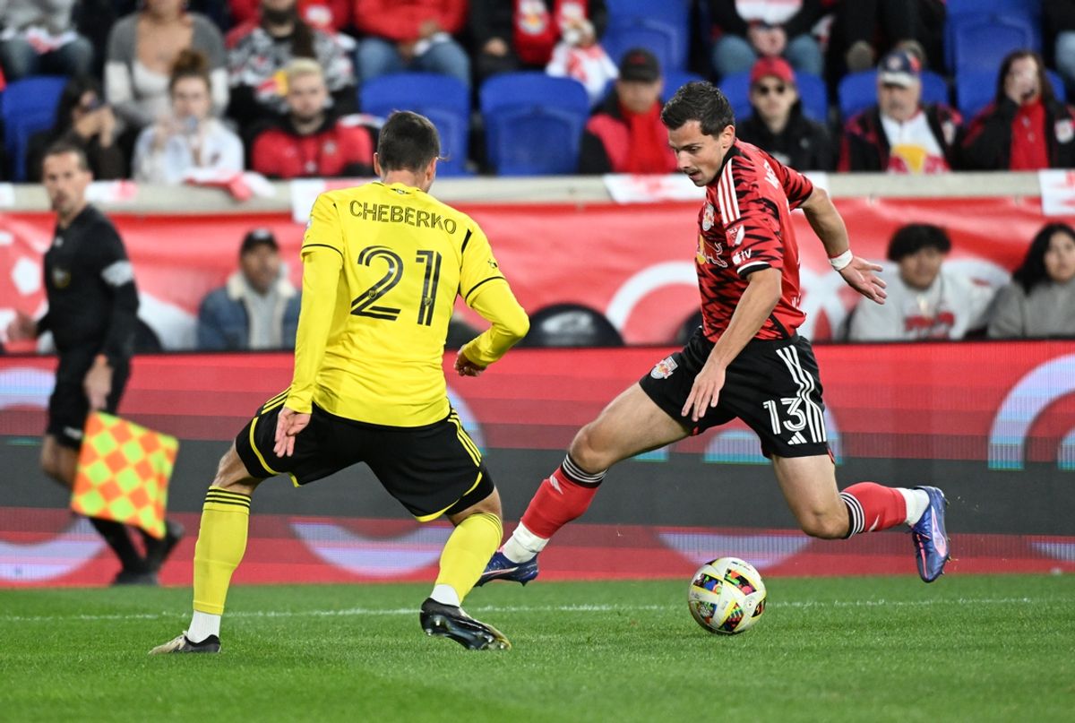 Nov 3, 2024; Harrison, New Jersey, USA; New York Red Bulls forward Dante Vanzeir (13) and Columbus Crew defender Yevhen Cheberko (21) battle for control of the ball during the first half in a 2024 MLS Cup Playoffs Round One matchat Red Bull Arena. Mandatory Credit: Mark Smith-Imagn Images