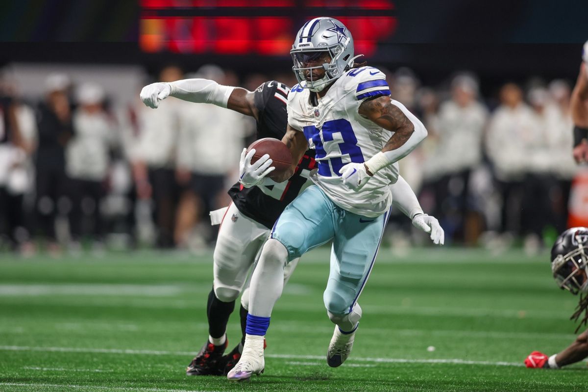 Nov 3, 2024; Atlanta, Georgia, USA; Dallas Cowboys running back Rico Dowdle (23) runs the ball against the Atlanta Falcons in the fourth quarter at Mercedes-Benz Stadium. Mandatory Credit: Brett Davis-Imagn Images