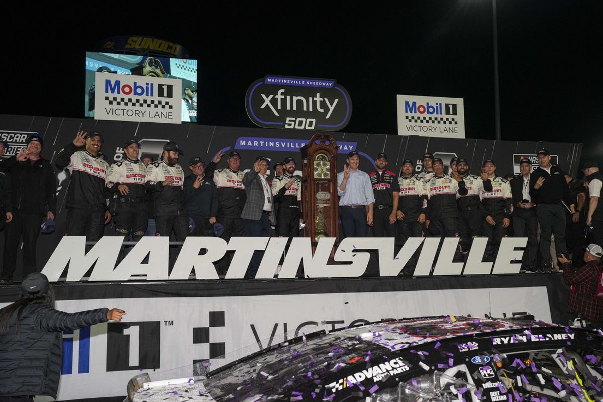 Nov 3, 2024; Martinsville, Virginia, USA;  NASCAR Cup Series driver Ryan Blaney (12) wins the Xfinity 500 at Martinsville Speedway. Mandatory Credit: Jim Dedmon-Imagn Images