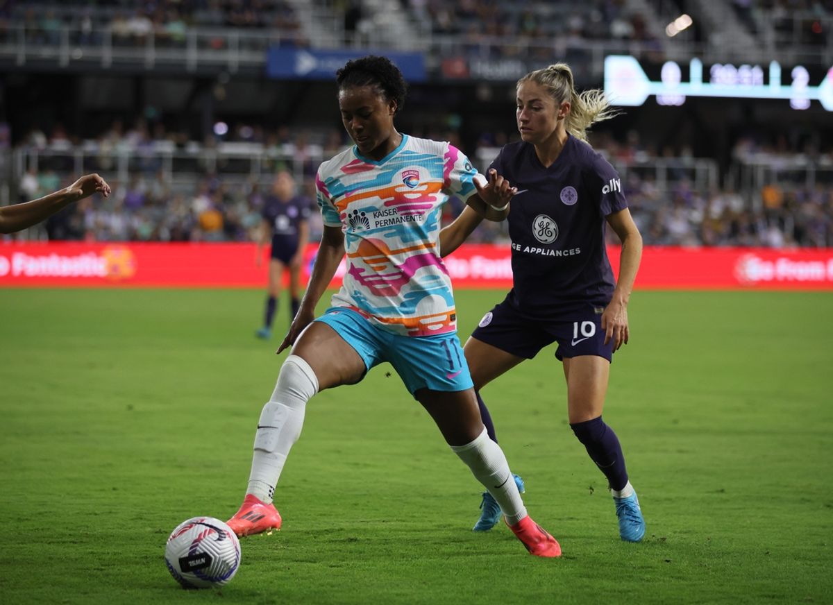 Nov 3, 2024; Louisville, Kentucky, USA; San Diego Wave FC forward Jaedyn Shaw (11) and Racing Louisville FC forward Janine Beckie (16) battle for control of the ball during the second half at Lynn Family Stadium. Mandatory Credit: EM Dash-Imagn Images