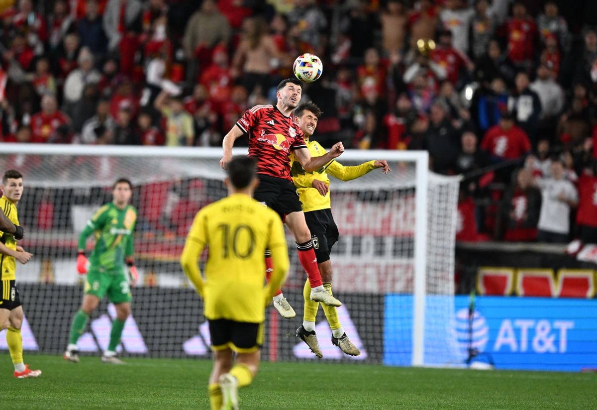 Nov 3, 2024; Harrison, New Jersey, USA; New York Red Bulls midfielder Lewis Morgan (9) and Columbus Crew defender Yevhen Cheberko (21) battle for control of the ball during the second half in a 2024 MLS Cup Playoffs Round One matchat Red Bull Arena. Mandatory Credit: Mark Smith-Imagn Images