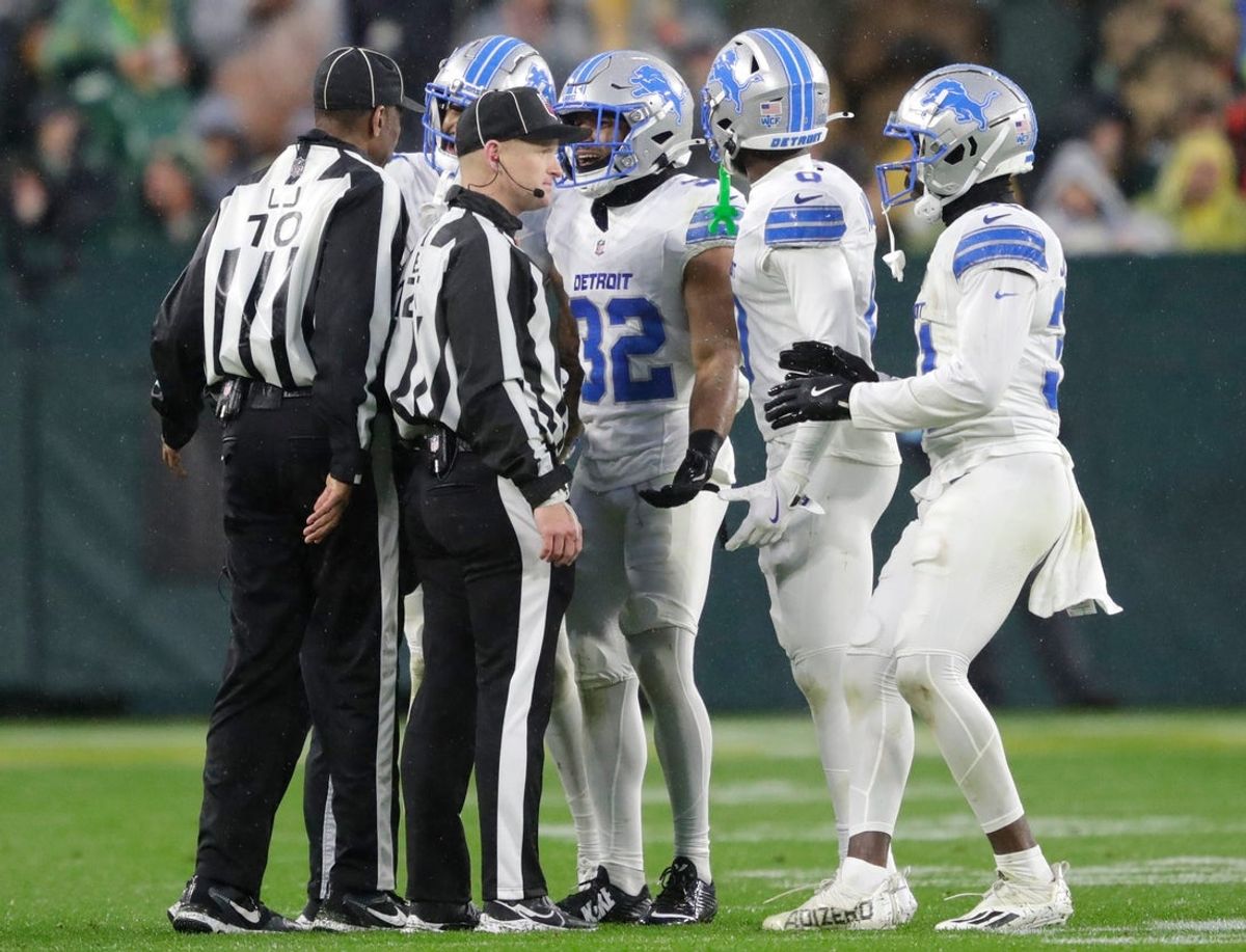 Detroit Lions safety Brian Branch (32) is ejected for an unsportsman like penalty on a hit against Green Bay Packers wide receiver Bo Melton (80) during their football game Sunday, November 3, 2024, at Lambeau Field in Green Bay, Wisconsin.
