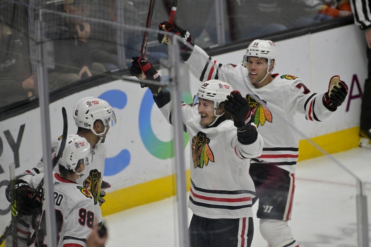 Nov 3, 2024; Anaheim, California, USA;  Chicago Blackhawks left wing Taylor Hall (71), left wing Tyler Bertuzzi (59) and center Connor Bedard (98) celebrate after a goal by defenseman Isaak Phillips (41) in the first period against the Anaheim Ducks at Honda Center. Mandatory Credit: Jayne Kamin-Oncea-Imagn Images