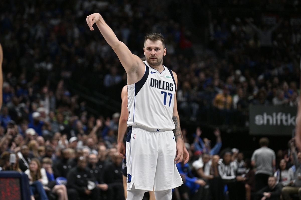 Nov 3, 2024; Dallas, Texas, USA; Dallas Mavericks guard Luka Doncic (77) poses after he makes a three point basket against the Orlando Magic during the second quarter at the American Airlines Center. Mandatory Credit: Jerome Miron-Imagn Images