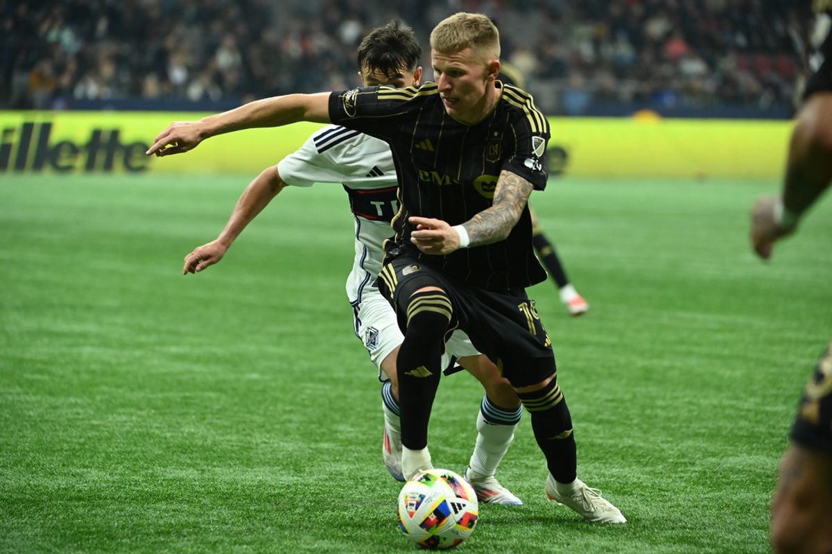 Nov 3, 2024; Vancouver, British Columbia, CAN; LAFC midfielder Mateusz Bogusz (19) plays the ball in the second half against the Vancouver Whitecaps in a 2024 MLS Cup Playoffs Round One match at BC Place. Mandatory Credit: Simon Fearn-Imagn Images