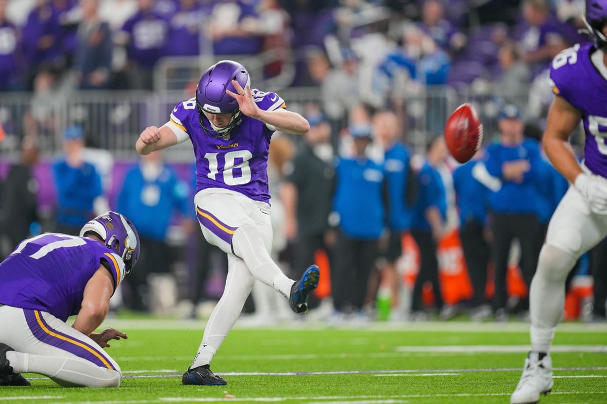Nov 3, 2024; Minneapolis, Minnesota, USA; Minnesota Vikings place kicker Will Reichard (16) kicks an extra point against the Indianapolis Colts in the fourth quarter at U.S. Bank Stadium. Mandatory Credit: Brad Rempel-Imagn Images