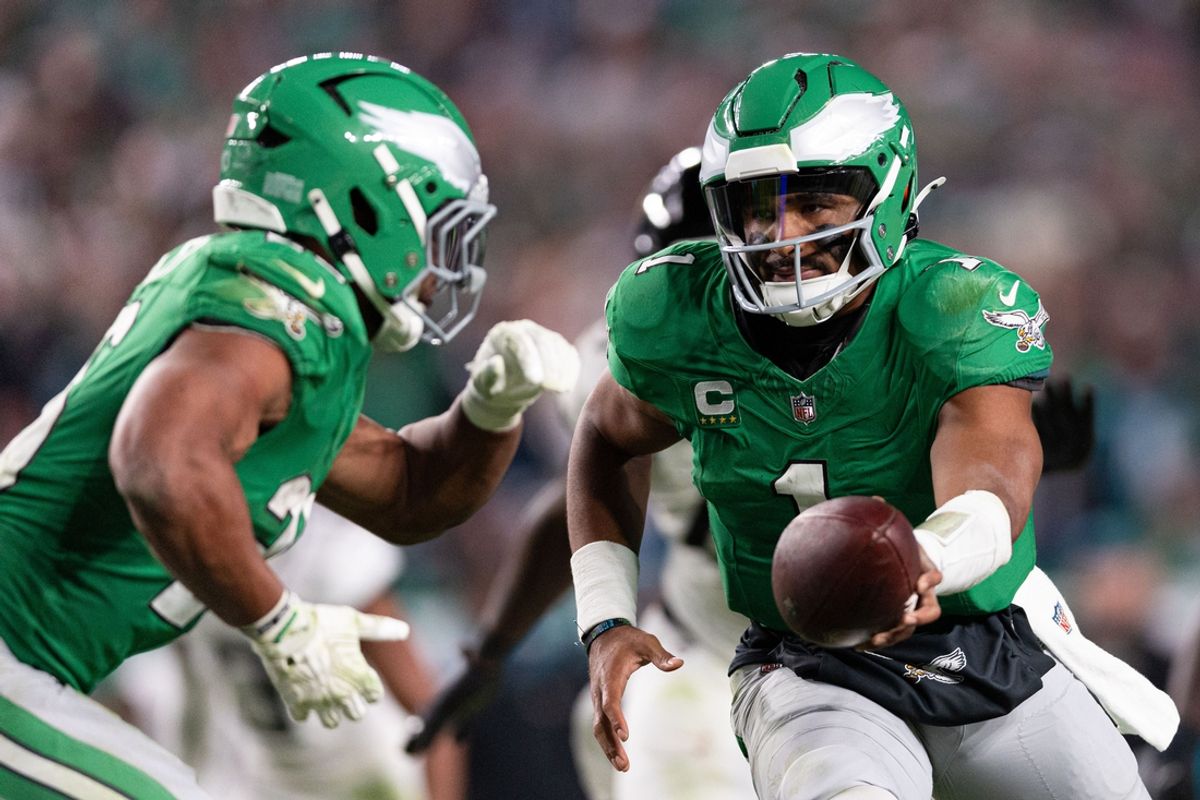 Nov 3, 2024; Philadelphia, Pennsylvania, USA; Philadelphia Eagles quarterback Jalen Hurts (1) hands off to running back Saquon Barkley (26) in a game against the Jacksonville Jaguars at Lincoln Financial Field. Mandatory Credit: Bill Streicher-Imagn Images