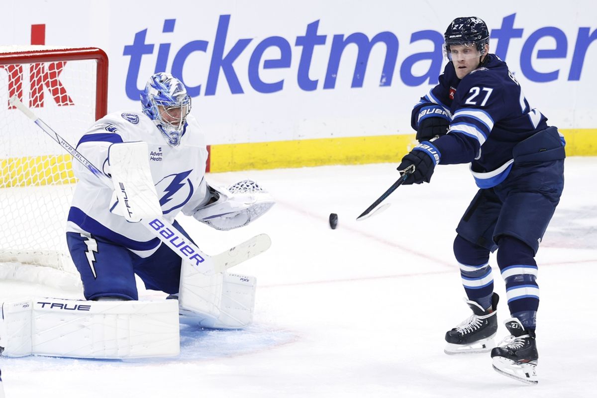 Nov 3, 2024; Winnipeg, Manitoba, CAN; Winnipeg Jets left wing Nikolaj Ehlers (27) tries a tip in on Tampa Bay Lightning goaltender Jonas Johansson (31) in the third period at Canada Life Centre. Mandatory Credit: James Carey Lauder-Imagn Images