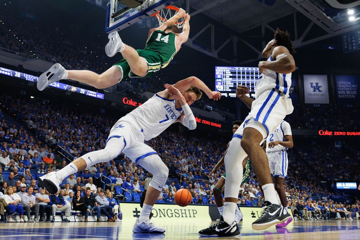 Nov 4, 2024; Lexington, Kentucky, USA; Wright State Raiders forward Brandon Noel (14) dunks the ball over Kentucky Wildcats forward Andrew Carr (7) during the first half at Rupp Arena at Central Bank Center. Mandatory Credit: Jordan Prather-Imagn Images