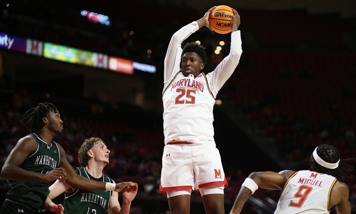 Nov 4, 2024; College Park, Maryland, USA; Maryland Terrapins center Derik Queen (25) grabs a rebound during the first half against the Manhattan Jaspers at Xfinity Center. Mandatory Credit: Daniel Kucin Jr.-Imagn Images