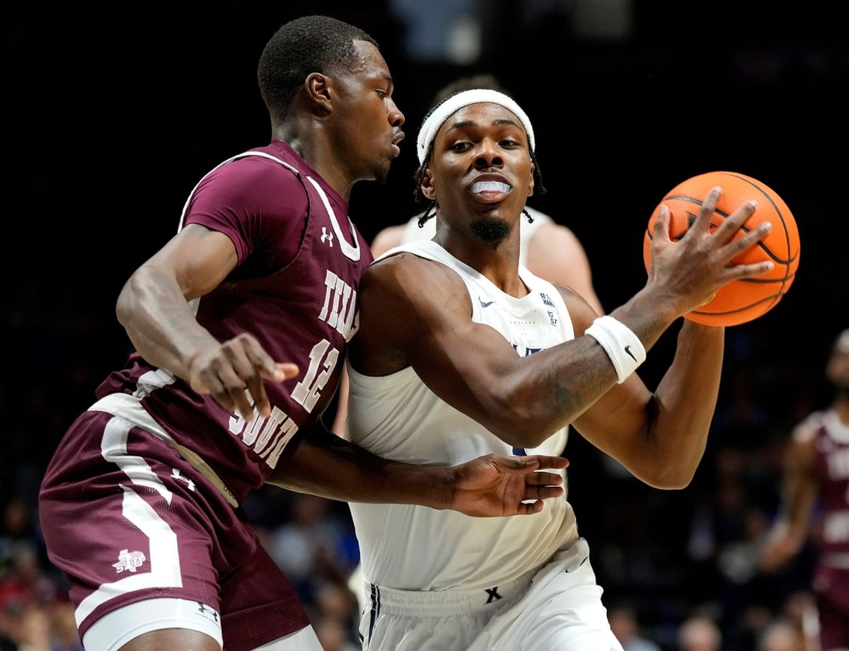 Xavier Musketeers guard Ryan Conwell (7) gets pressure from Texas Southern Tigers guard Zytarious Mortle (12) in the first half on Monday, November 4, 2024 at the Cintas Center.