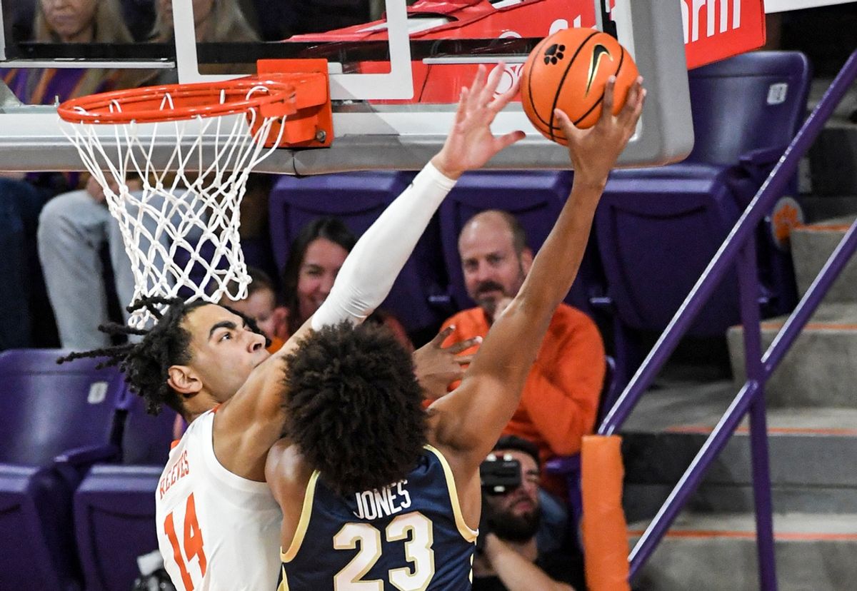 Nov 4, 2024; Clemson, SC, USA; Clemson center Christian Reeves (14) defends a shot by Charleston Southern University forward Reis Jones (23) during the first half at Littlejohn Coliseum in Clemson, S.C Monday, November 4, 2024.       Mandatory Credit: Ken Ruinard/USA TODAY Network via Imagn Images
