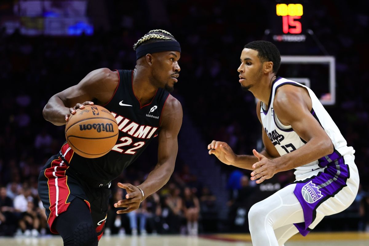 Nov 4, 2024; Miami, Florida, USA; Miami Heat forward Jimmy Butler (22) drives to the basket against Sacramento Kings forward Keegan Murray (13) during the first quarter at Kaseya Center. Mandatory Credit: Sam Navarro-Imagn Images