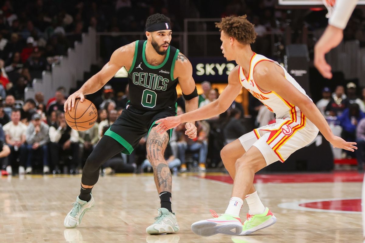 Nov 4, 2024; Atlanta, Georgia, USA; Boston Celtics forward Jayson Tatum (0) is defended by Atlanta Hawks guard Dyson Daniels (5) in the second quarter at State Farm Arena. Mandatory Credit: Brett Davis-Imagn Images