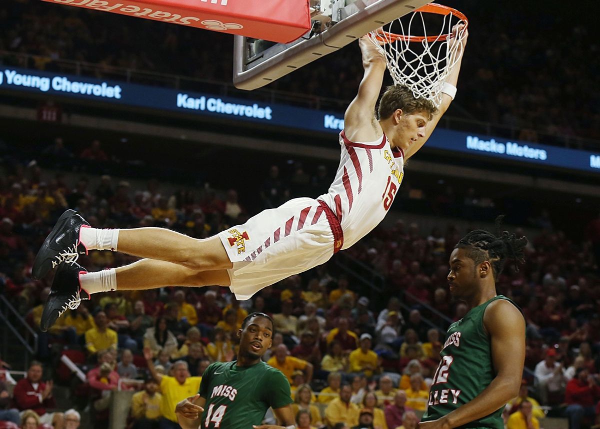 Iowa State cyclones guard Nojus Indrusaitis (15) Hans on the basket after a dunk around Mississippi Valley State Delta Devils' guard Kendal Parker (12) during first half in the NCAA men’s basketball home opening at Hilton Coliseum on Monday, Nov. 4, 2024, in Ames, Iowa.