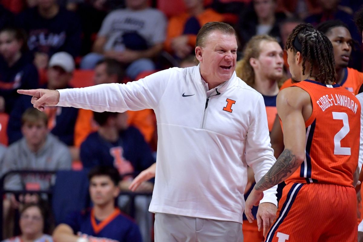 Nov 4, 2024; Champaign, Illinois, USA;  Illinois Fighting Illini head coach Brad Underwood talks with Illinois Fighting Illini guard Dra Gibbs-Lawhorn (2) during the first half against the Eastern Illinois Panthers at State Farm Center. Mandatory Credit: Ron Johnson-Imagn Images