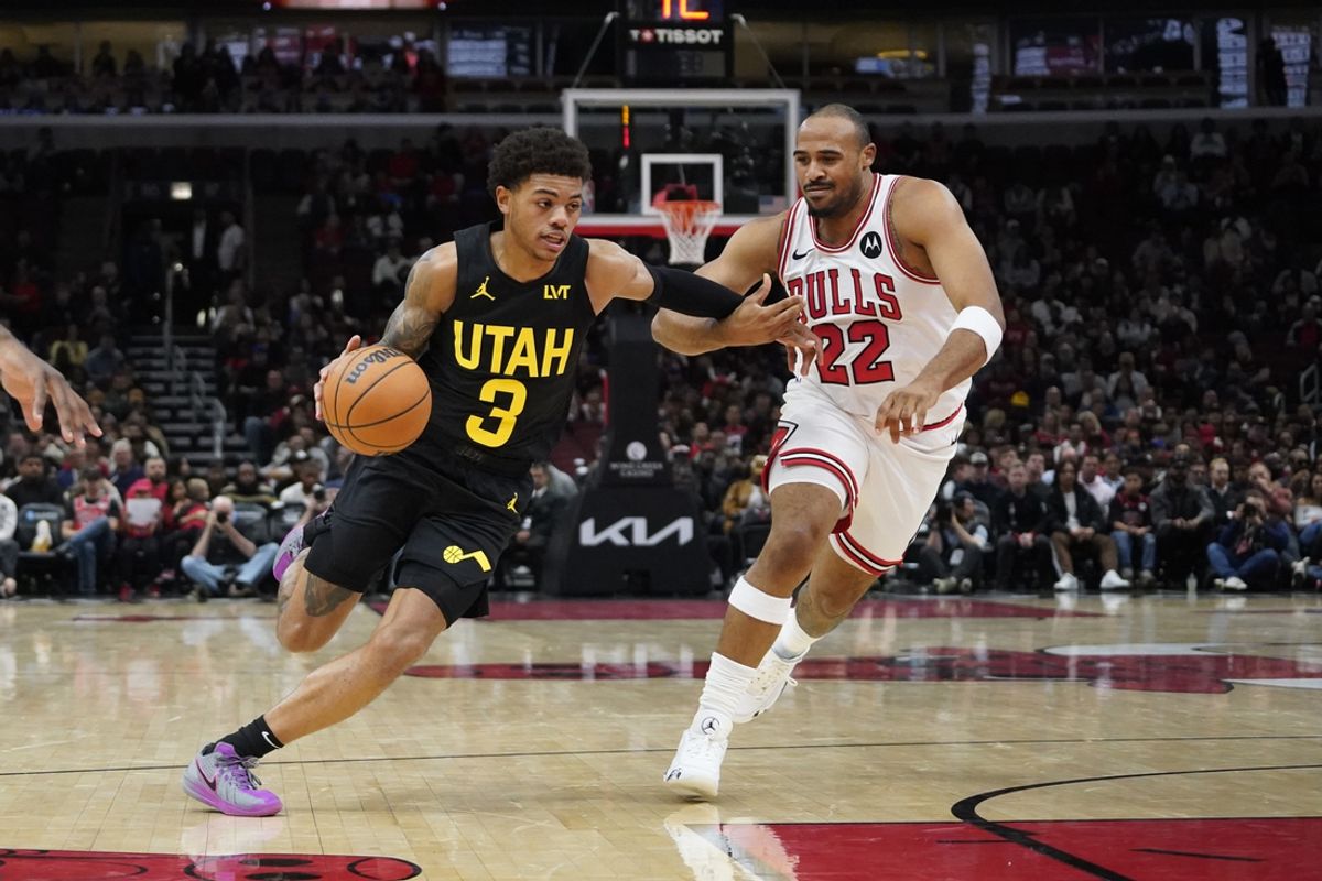 Nov 4, 2024; Chicago, Illinois, USA; Chicago Bulls forward Talen Horton-Tucker (22) defends Utah Jazz guard Keyonte George (3) during the first quarter at United Center. Mandatory Credit: David Banks-Imagn Images
