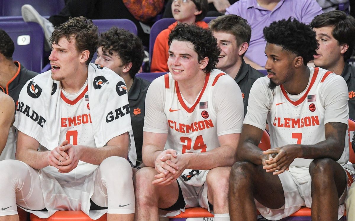 Clemson sophomore center Viktor Lakhin (0), senior forward Ian Schieffelin (24) and forward Chauncey Wiggins (7) watch bench players play in the closing minute with Charleston Southern University during the second half at Littlejohn Coliseum in Clemson, S.C Monday, November 4, 2024.