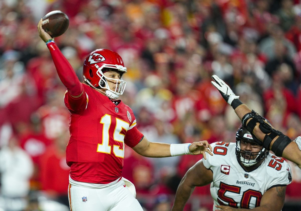 Nov 4, 2024; Kansas City, Missouri, USA; Kansas City Chiefs quarterback Patrick Mahomes (15) throws a pass against Tampa Bay Buccaneers defensive tackle Vita Vea (50) during the first half at GEHA Field at Arrowhead Stadium. Mandatory Credit: Jay Biggerstaff-Imagn Images