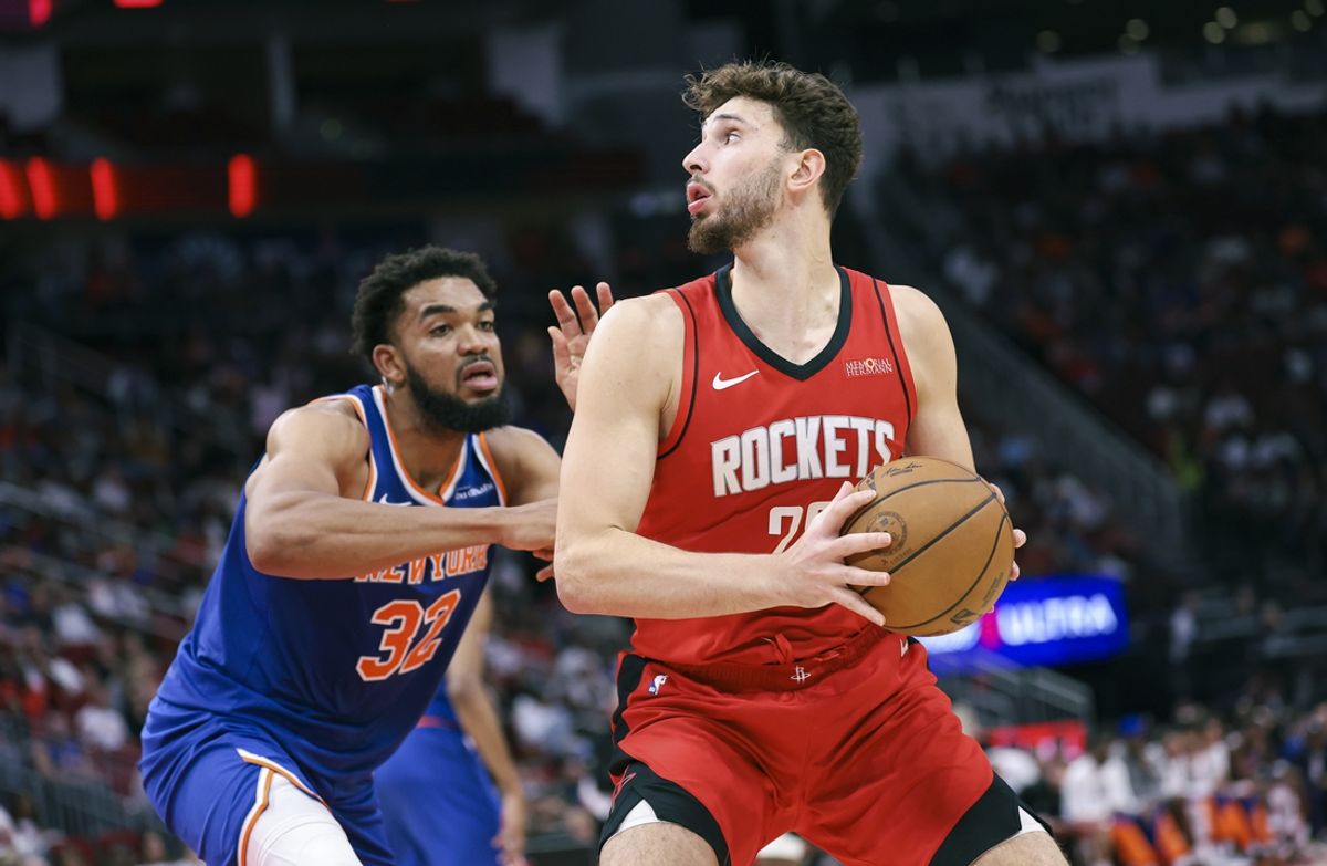 Nov 4, 2024; Houston, Texas, USA; Houston Rockets center Alperen Sengun (28) controls the ball as New York Knicks center Karl-Anthony Towns (32) defends during the first quarter at Toyota Center. Mandatory Credit: Troy Taormina-Imagn Images