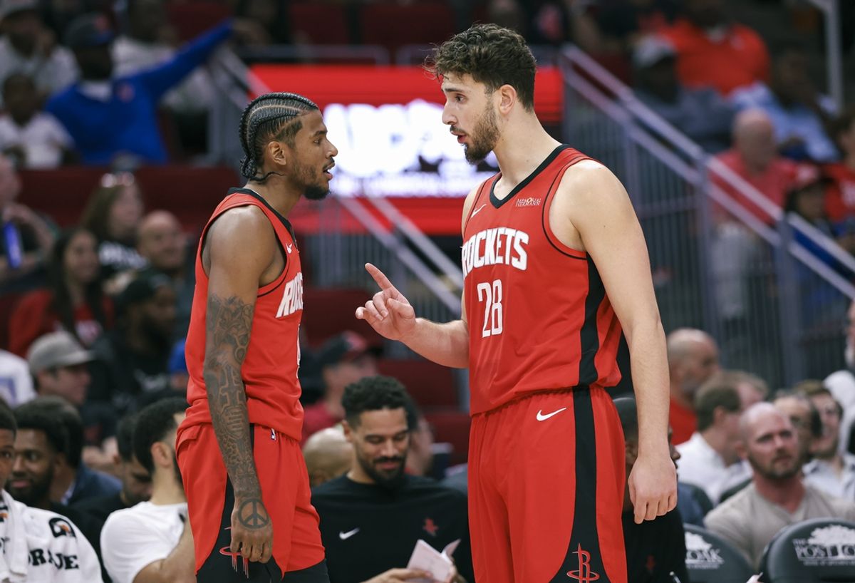 Nov 4, 2024; Houston, Texas, USA; Houston Rockets guard Jalen Green (4) and Houston Rockets center Alperen Sengun (28) talk on the sideline during the second quarter against the New York Knicks at Toyota Center. Mandatory Credit: Troy Taormina-Imagn Images