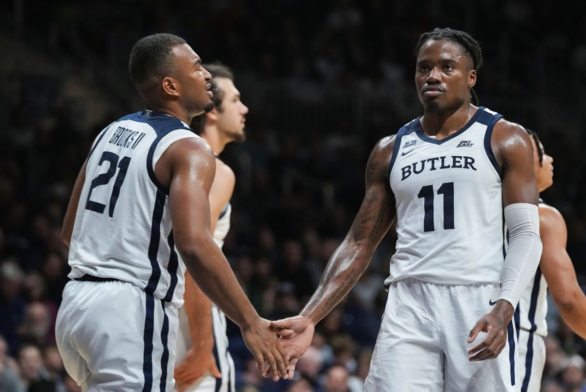 Butler Bulldogs forward Jahmyl Telfort (11) high-fives Butler Bulldogs forward Pierre Brooks II (21) on Monday, Nov. 4, 2024, during the game at Hinkle Fieldhouse in Indianapolis. The Butler Bulldogs defeated the Missouri State Bears, 72-65.
