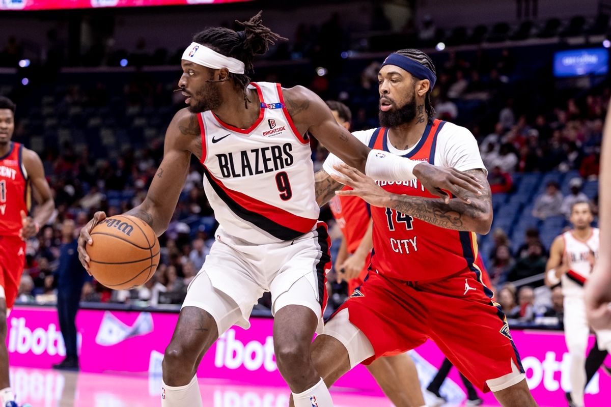 Nov 4, 2024; New Orleans, Louisiana, USA;  Portland Trail Blazers forward Jerami Grant (9) dribbles against New Orleans Pelicans forward Brandon Ingram (14) during the first half at Smoothie King Center. Mandatory Credit: Stephen Lew-Imagn Images