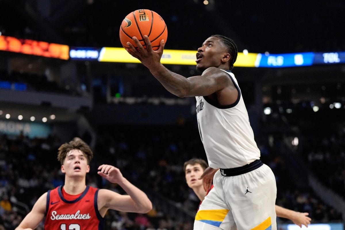 Nov 4, 2024; Milwaukee, Wisconsin, USA;  Marquette Golden Eagles guard Kam Jones (1) shoots during the second half against the Stony Brook Seawolves at Fiserv Forum. Mandatory Credit: Jeff Hanisch-Imagn Images