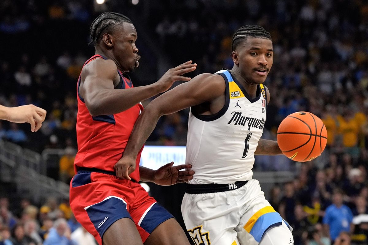 Nov 4, 2024; Milwaukee, Wisconsin, USA;  Marquette Golden Eagles guard Kam Jones (1) drives for the basket during the second half against the Stony Brook Seawolves at Fiserv Forum. Mandatory Credit: Jeff Hanisch-Imagn Images