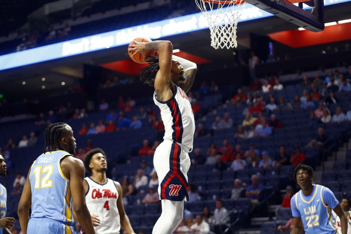 Nov 4, 2024; Oxford, Mississippi, USA; Mississippi Rebels guard Dre Davis (14) dunks during the second half against the Long Island Sharks at The Sandy and John Black Pavilion at Ole Miss. Mandatory Credit: Petre Thomas-Imagn Images