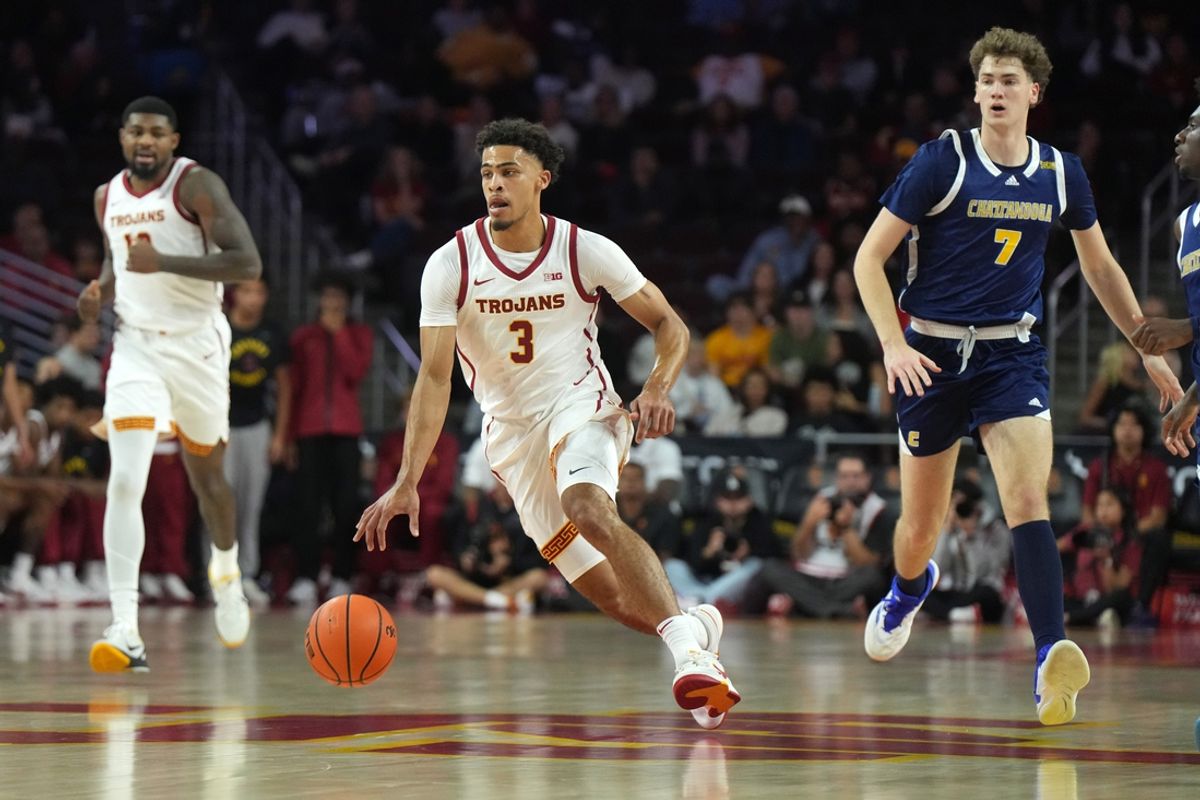 Nov 4, 2024; Los Angeles, California, USA; Southern California Trojans forward Matt Knowling (3) dribbles the ball against Chattanooga Mocs forward Sean Cusano (7) in the first half at Galen Center. Mandatory Credit: Kirby Lee-Imagn Images