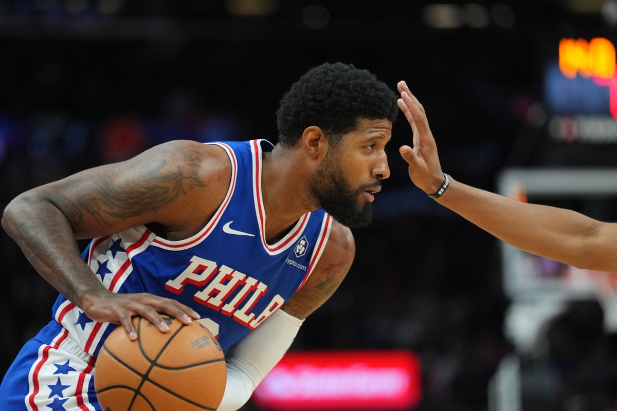 Nov 4, 2024; Phoenix, Arizona, USA; Philadelphia 76ers forward Paul George (8) protects the ball against the Phoenix Suns during the first half at Footprint Center. Mandatory Credit: Joe Camporeale-Imagn Images