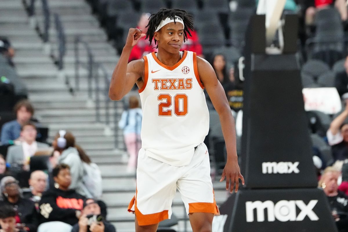 Nov 4, 2024; Las Vegas, Nevada, USA; Texas Longhorns guard Tre Johnson (20) gestures after scoring against the Ohio State Buckeyes during the first half at T-Mobile Arena. Mandatory Credit: Stephen R. Sylvanie-Imagn Images