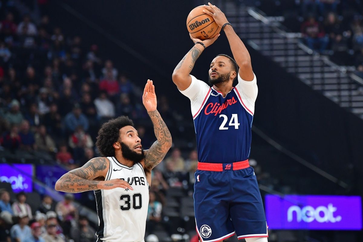 Nov 4, 2024; Inglewood, California, USA; Los Angeles Clippers guard Norman Powell (24) shoots against San Antonio Spurs forward Julian Champagnie (30) during the first half at Intuit Dome. Mandatory Credit: Gary A. Vasquez-Imagn Images
