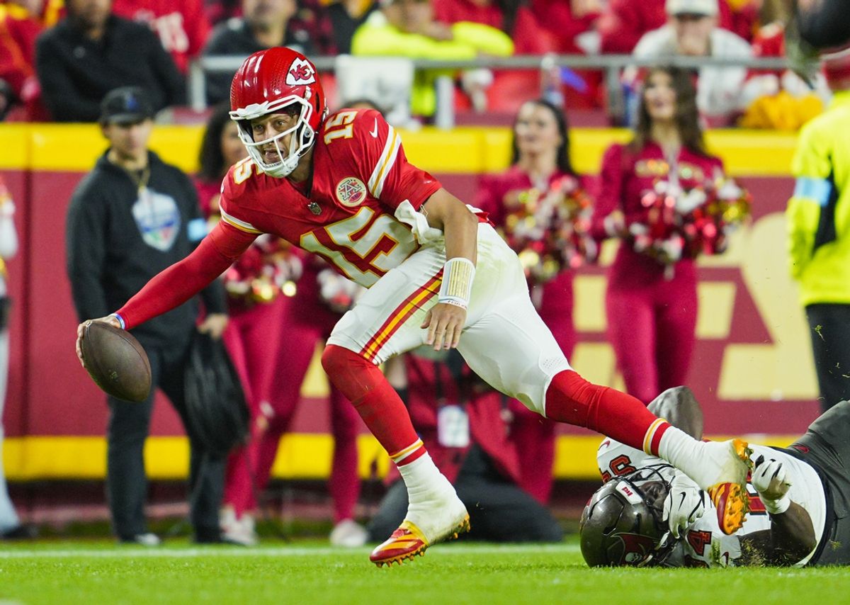 Nov 4, 2024; Kansas City, Missouri, USA; Kansas City Chiefs quarterback Patrick Mahomes (15) scrambles from Tampa Bay Buccaneers linebacker Lavonte David (54) during the second half at GEHA Field at Arrowhead Stadium. Mandatory Credit: Jay Biggerstaff-Imagn Images
