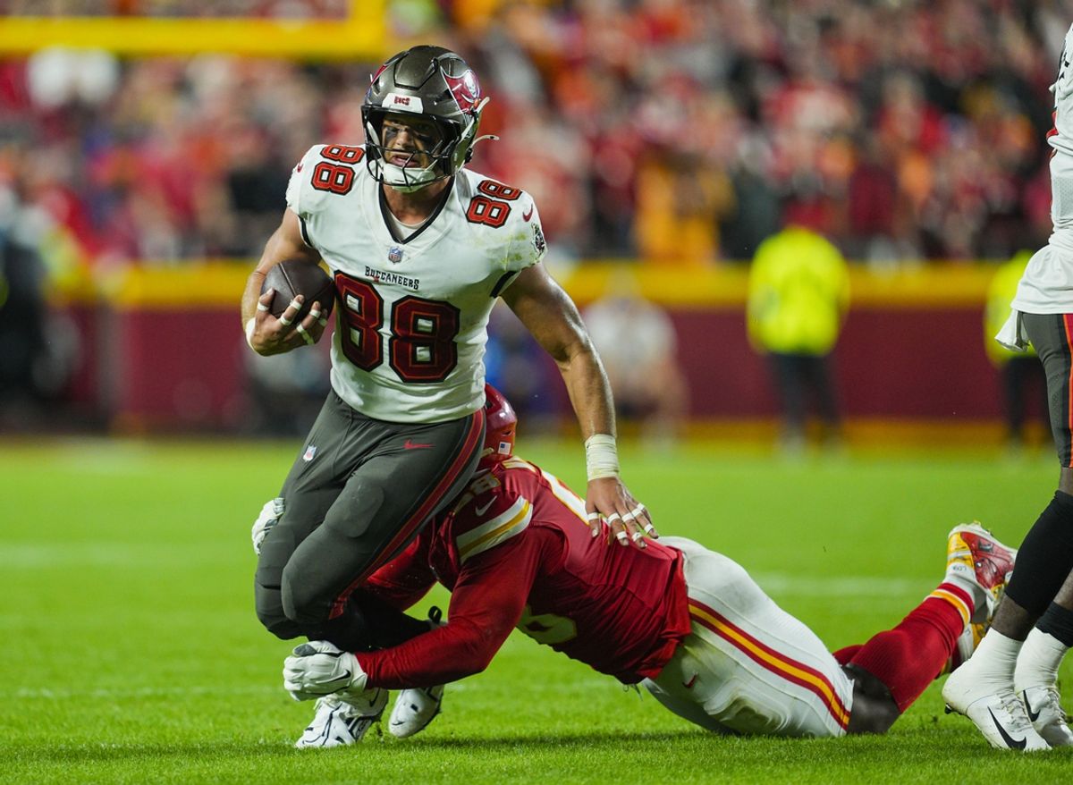 Nov 4, 2024; Kansas City, Missouri, USA; Tampa Bay Buccaneers tight end Cade Otton (88) is tackled by Kansas City Chiefs defensive tackle Tershawn Wharton (98) during the second half at GEHA Field at Arrowhead Stadium. Mandatory Credit: Jay Biggerstaff-Imagn Images