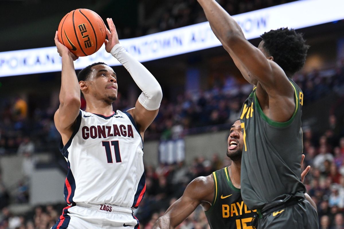 Nov 4, 2024; Spokane, Washington, USA; Gonzaga Bulldogs guard Nolan Hickman (11) shoots the ball against Baylor Bears guard VJ Edgecombe (7) in the first half at Spokane Arena. Mandatory Credit: James Snook-Imagn Images