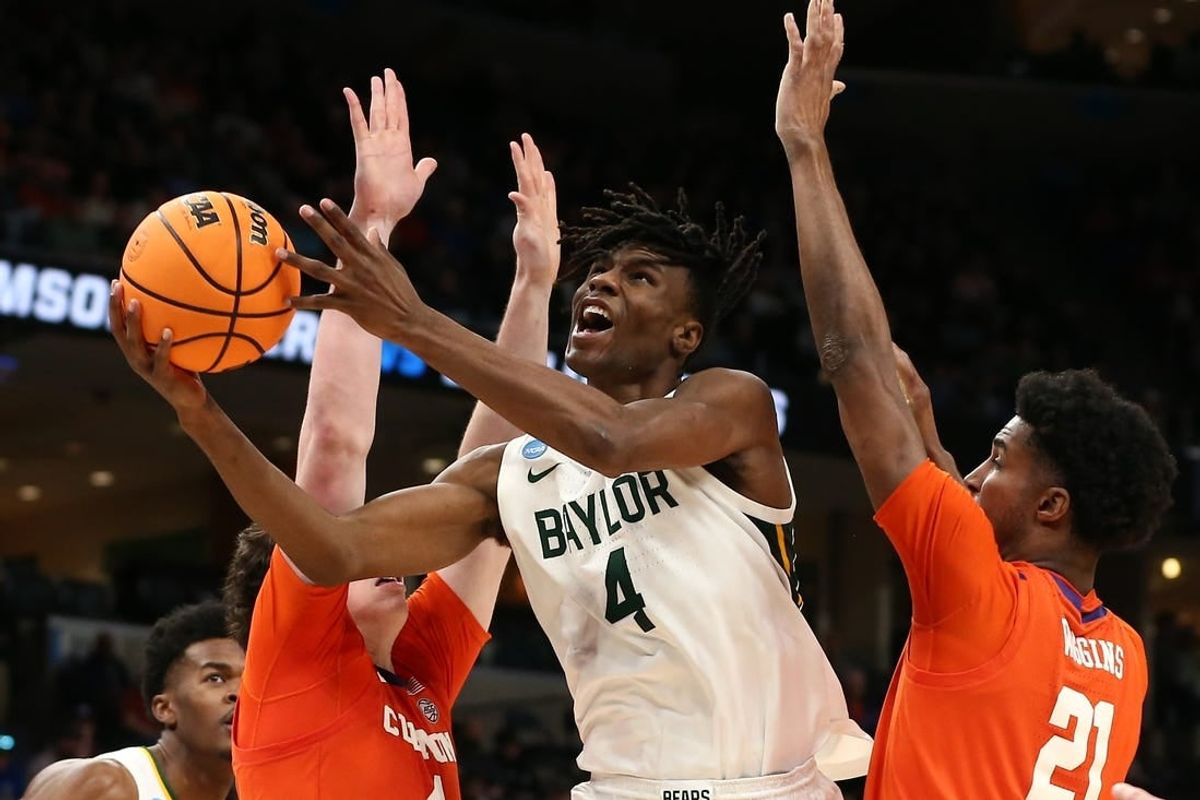 Mar 24, 2024; Memphis, TN, USA; Baylor Bears guard Ja'Kobe Walter (4) shoots against Clemson Tigers forward Ian Schieffelin (4) and forward Chauncey Wiggins (21) in the second half in the second round of the 2024 NCAA Tournament at FedExForum.