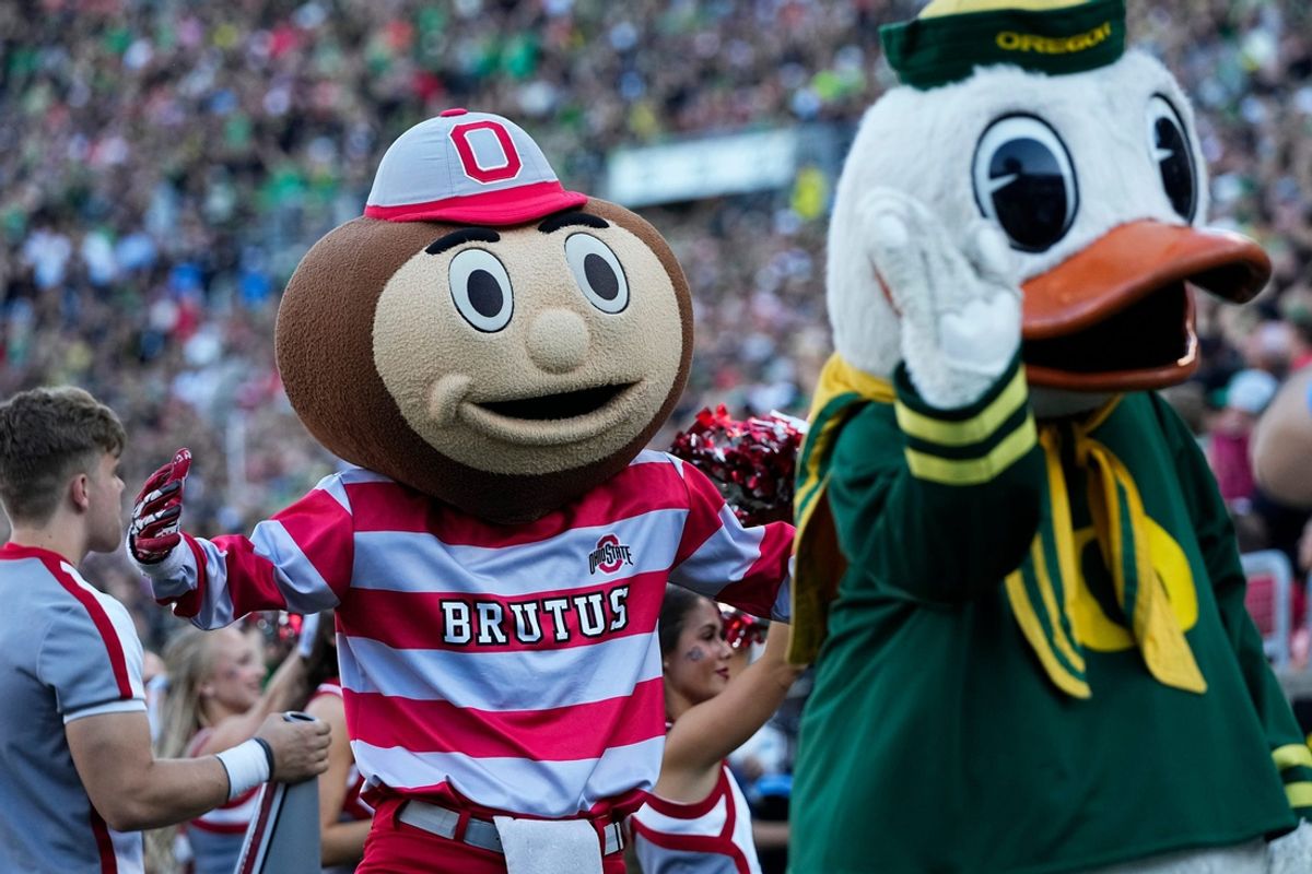Oct 12, 2024; Eugene, Oregon, USA; Ohio State Buckeyes mascot Brutus and the Oregon Duck interact during the first half of the NCAA football game at Autzen Stadium