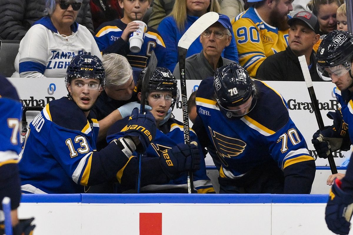 Nov 5, 2024; St. Louis, Missouri, USA;  St. Louis Blues center Dylan Holloway (81) is checked on by a trainer after he came off the ice from a shift against the Tampa Bay Lightning during the first period at Enterprise Center. Dylan Holloway was removed from the bench on a stretcher. Mandatory Credit: Jeff Curry-Imagn Images