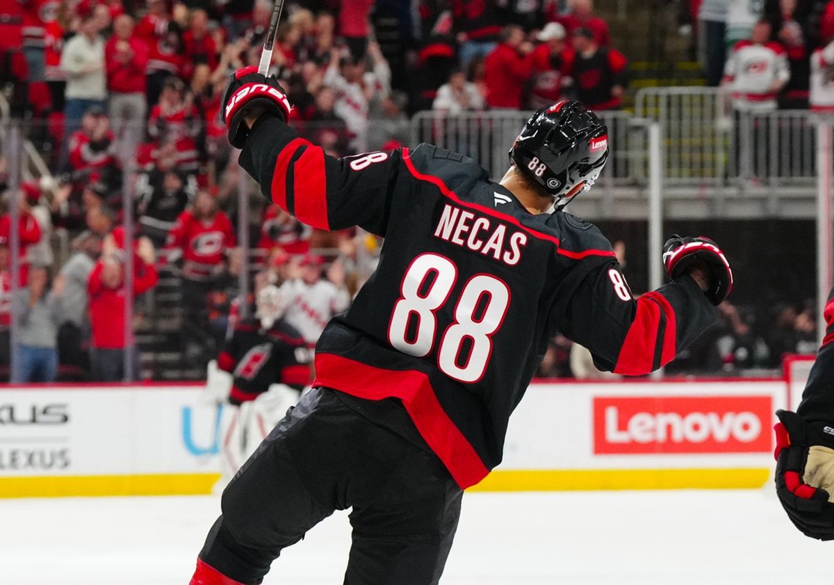 Nov 5, 2024; Raleigh, North Carolina, USA;  Carolina Hurricanes center Martin Necas (88) scores the game winner against the Philadelphia Flyers during the third period at Lenovo Center. Mandatory Credit: James Guillory-Imagn Images